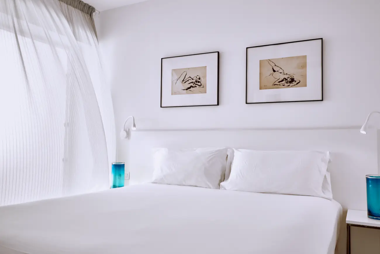Elegant bedroom design in the Emerald One Bedroom Suite at Baobab Suites