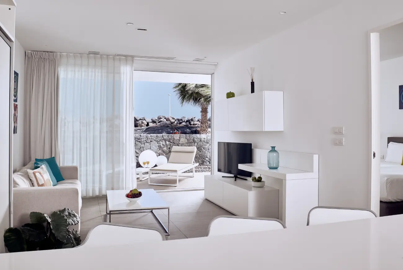 Living room of the Emerald One Bedroom Suite at Baobab Suites with terrace views