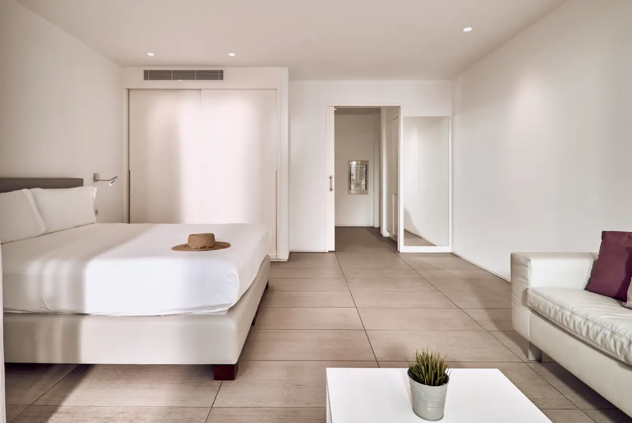 Baobab Suites Emerald One Bedroom Suite with king bed, lounge area and modern interior design