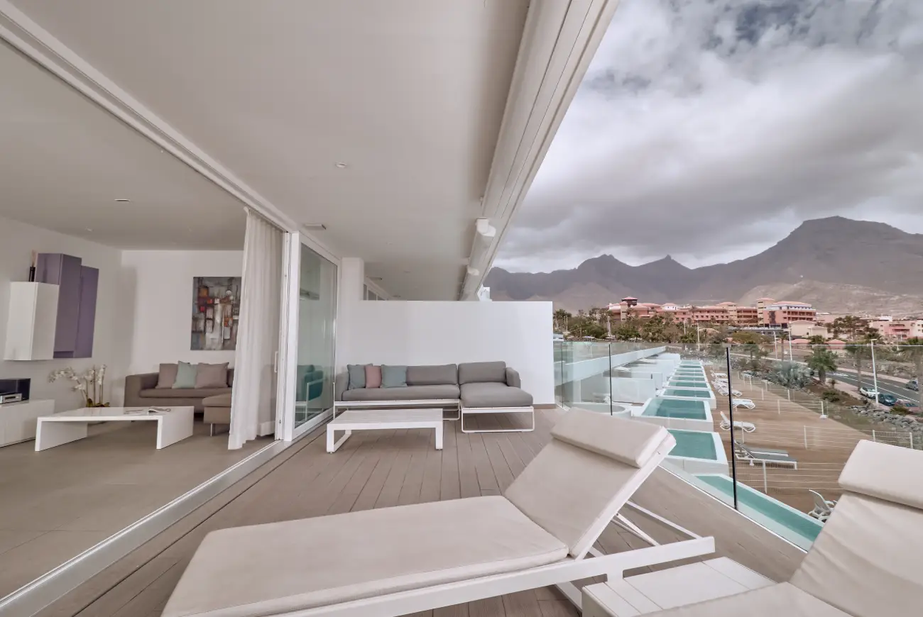Jade One Bedroom Suite with Side Sea View terrace with sun loungers and side sea view
