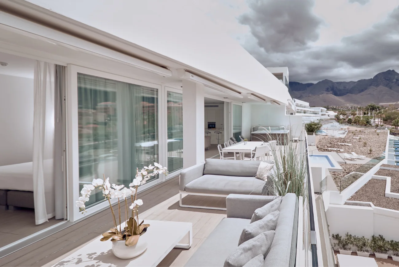Sapphire Two Bedroom Suite with Sea View and Jacuzzi terrace with jacuzzi and outdoor seating