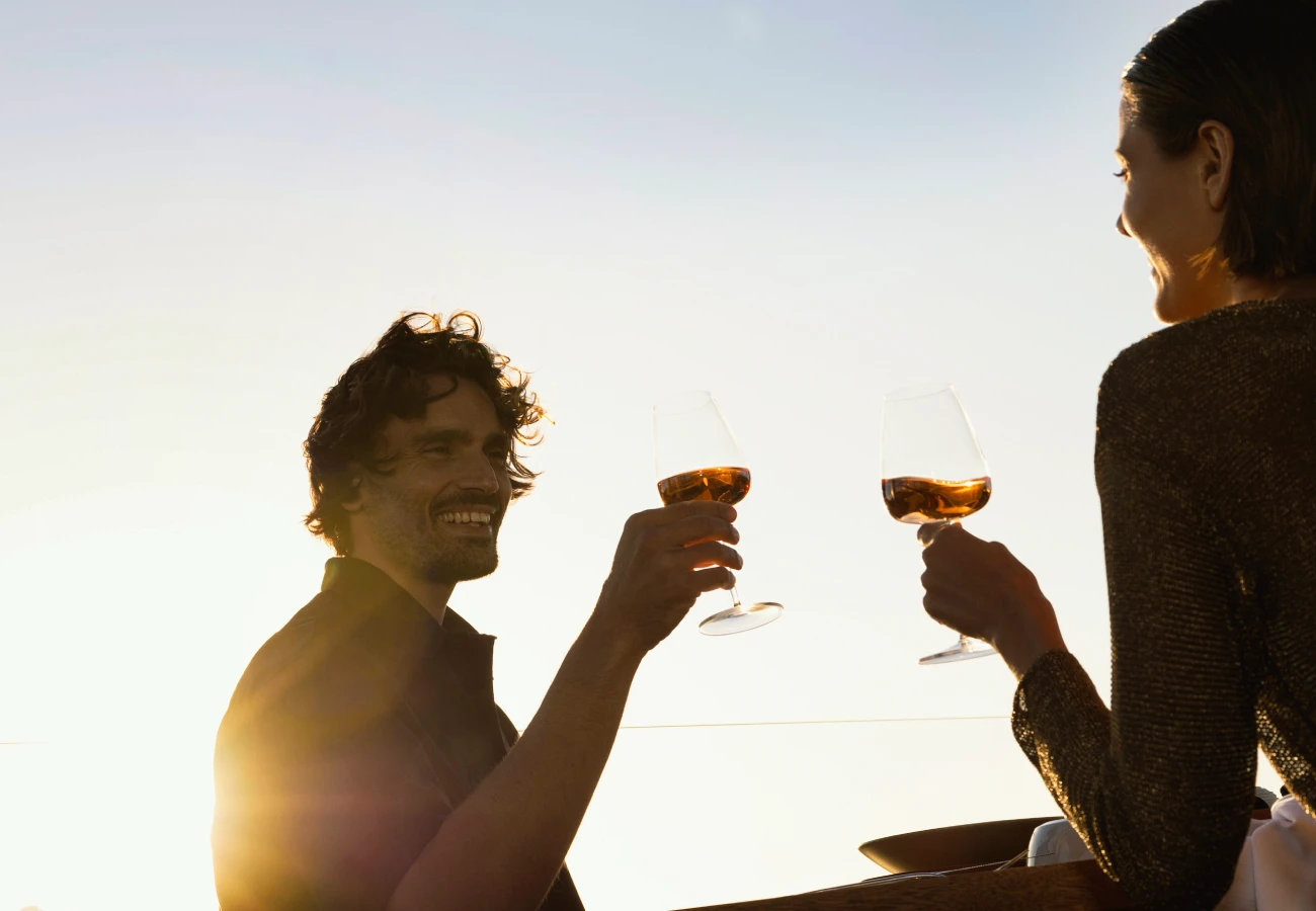 Elegant dining setup at Maitr & Margarita restaurant in Santorini resort