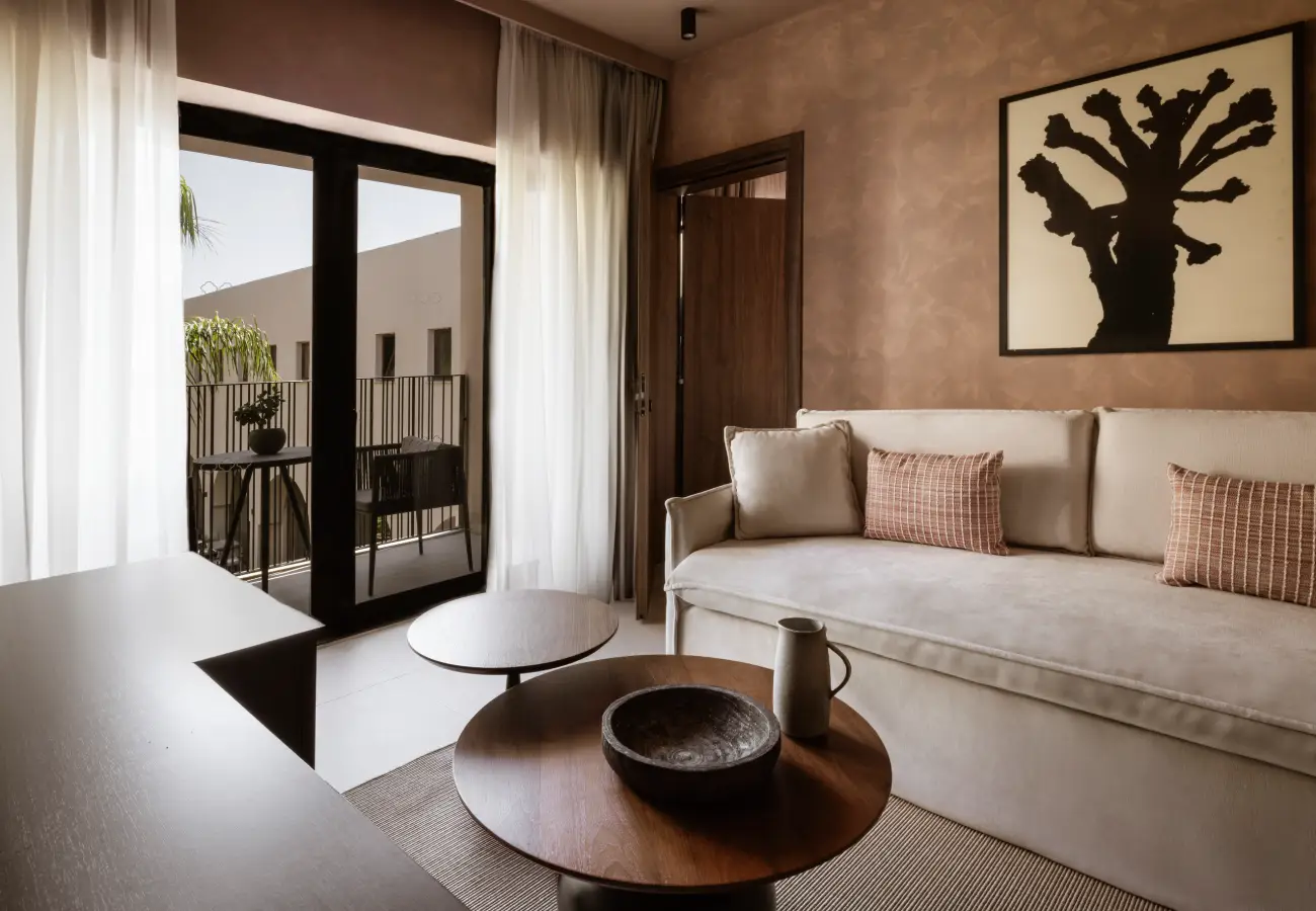 Interior of a serene, bohemian‑style room at Domes of Corfu