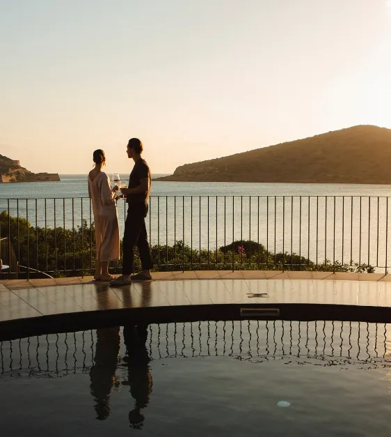 Domes of Elounda Guests Enjoying Spinalonga View by the Pool