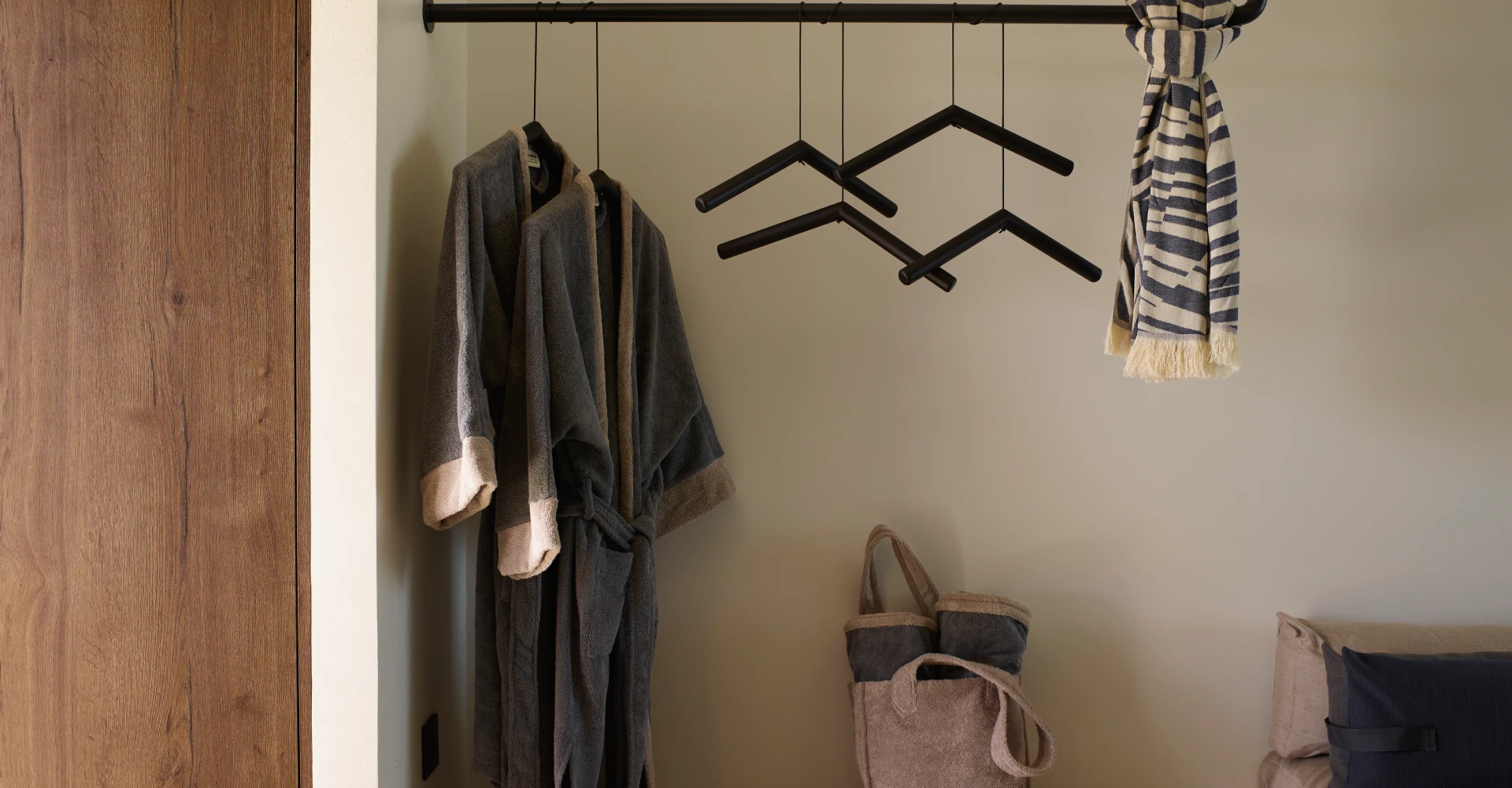 Luxury deluxe suite with spacious dressing area and unique minimalistic design at Domes White Coast Milos