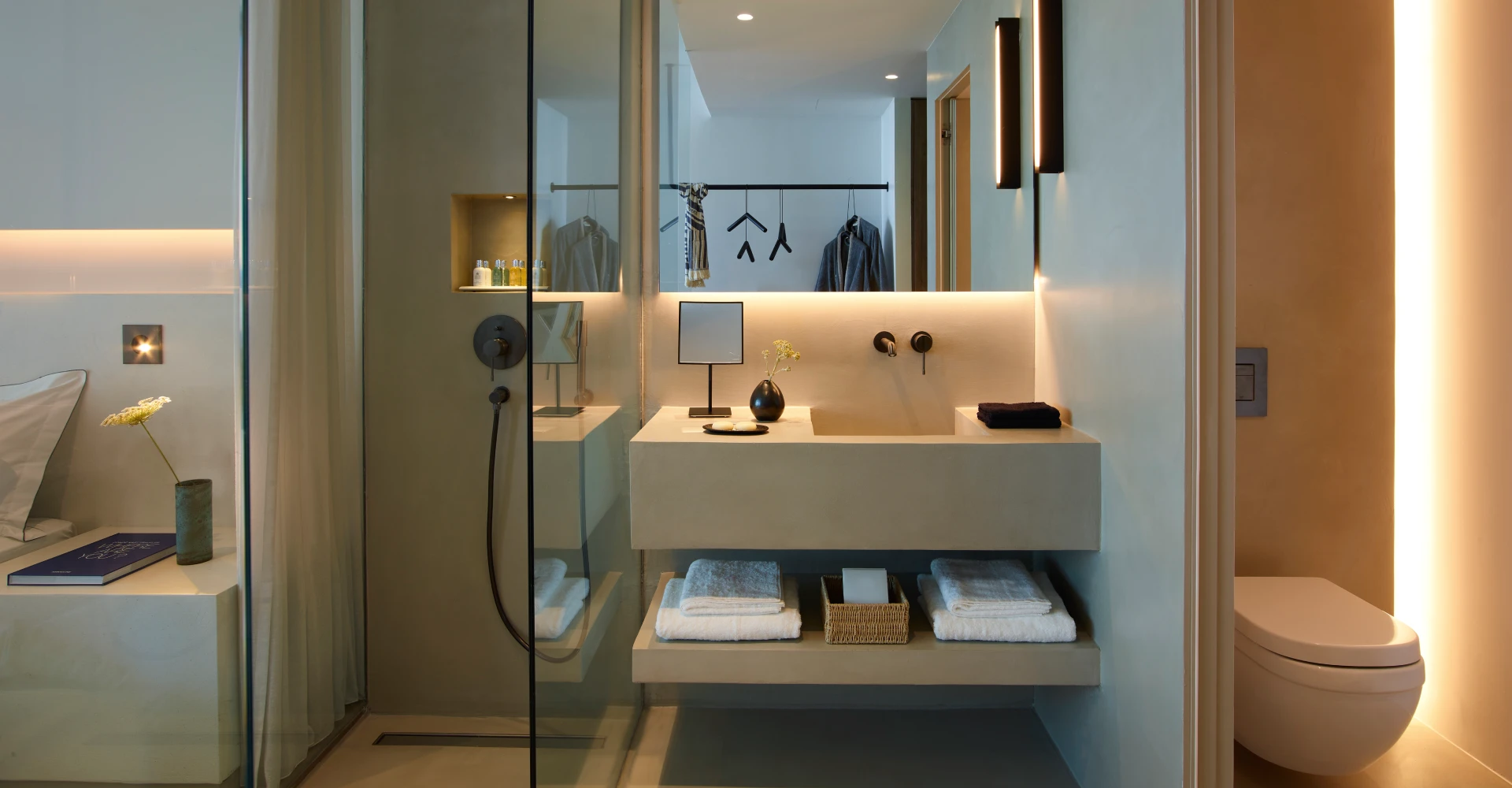 Open space glass door shower of minimal design at Domes White Coast Milos