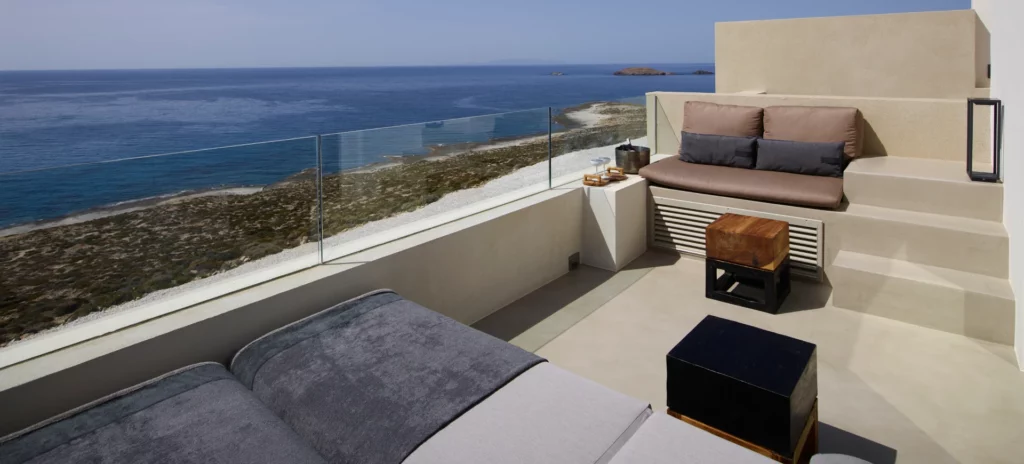Sublime sea view veranda with sunloungers, space for relaxation for plunge pool at Domes White Coast Milos
