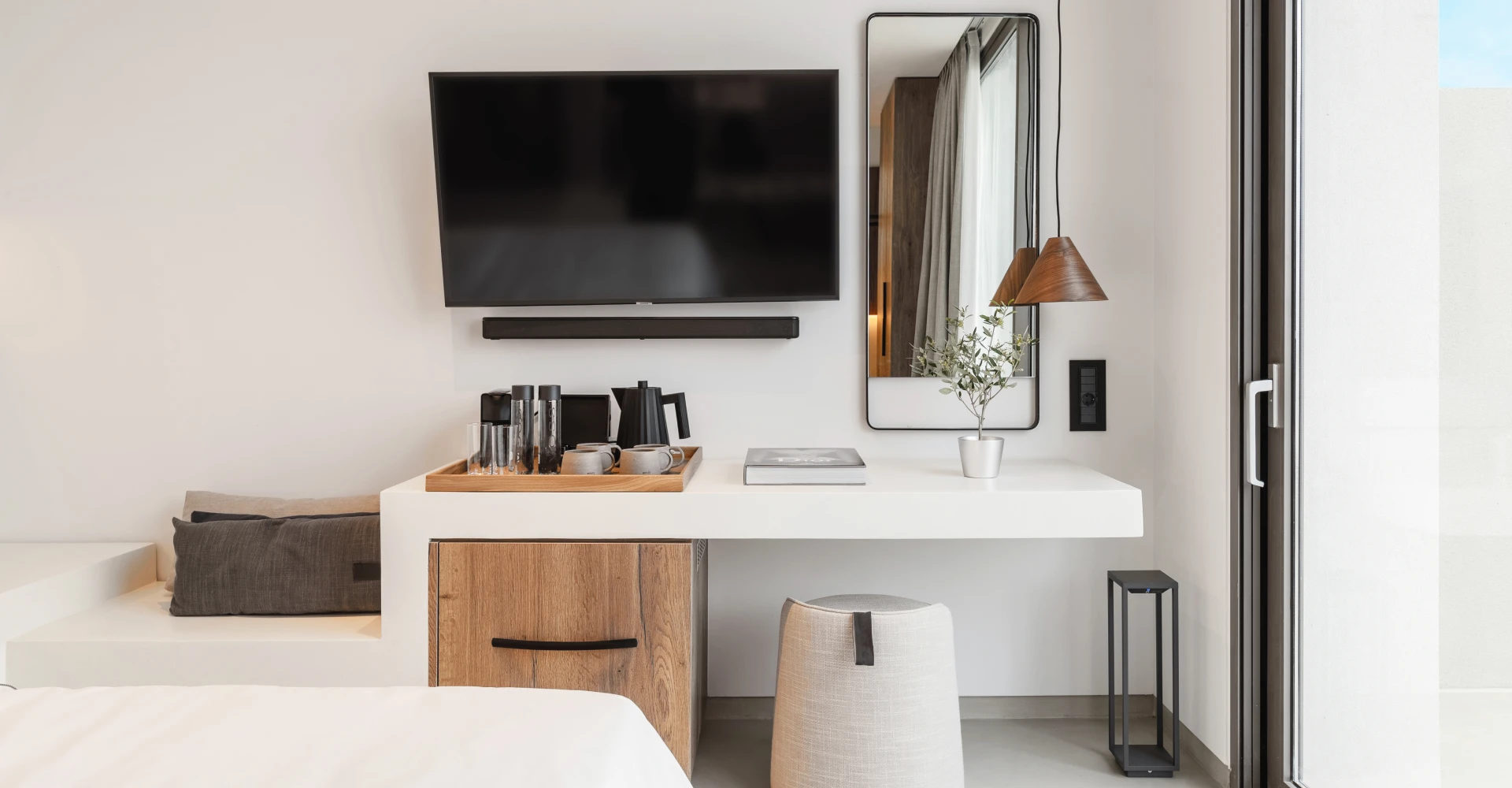 Superior suite with sea view and elegant working space at Domes White Coast Milos