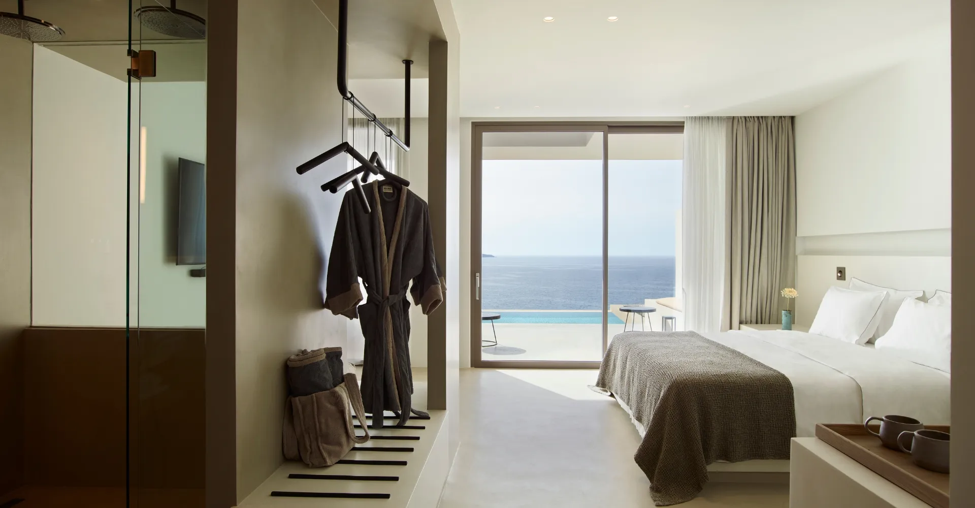 Spacious luxury suite with king size bed and, private pool and an oversized balcony with ocean view