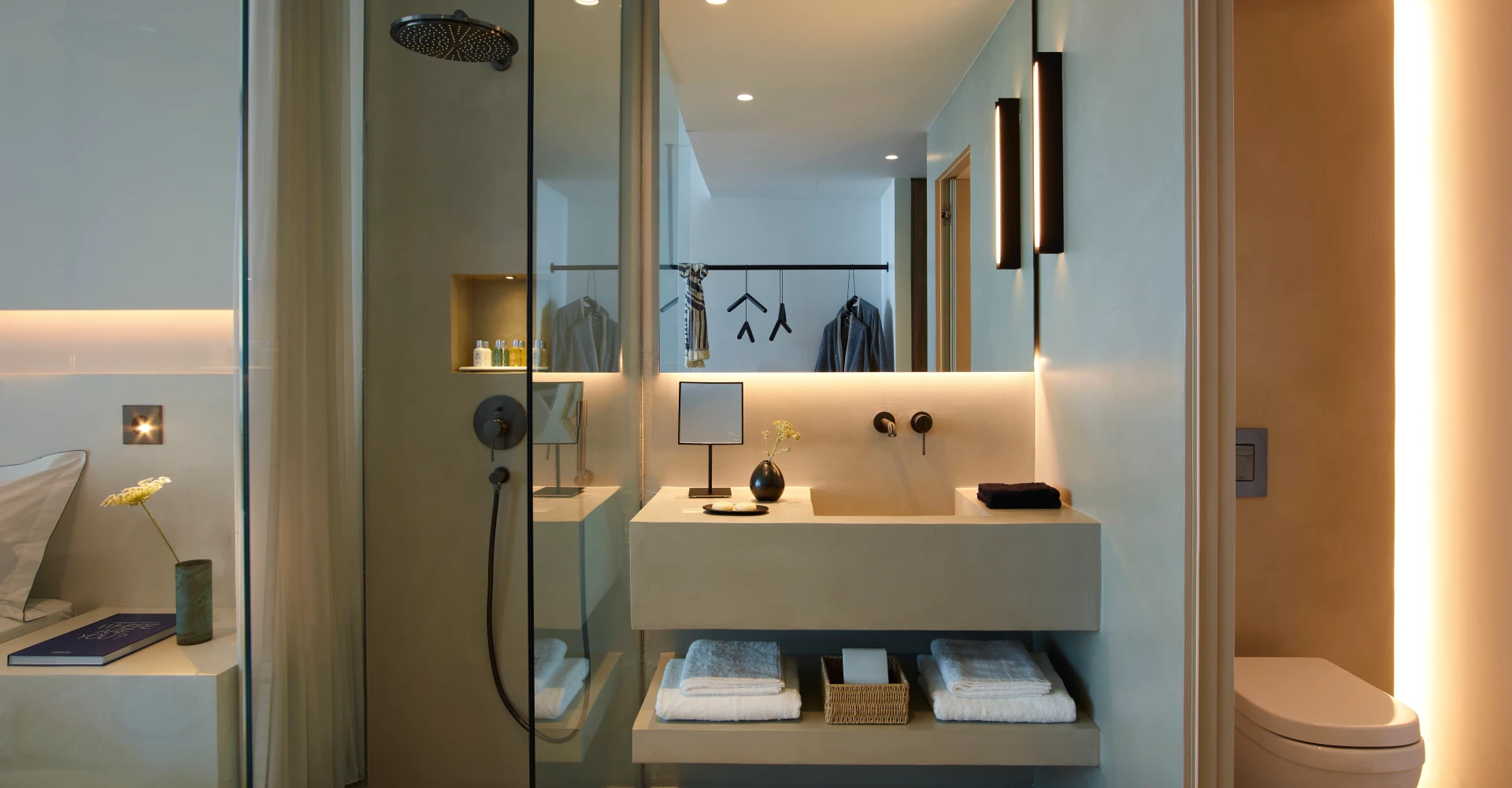 Open space glass door shower of minimal design at Domes White Coast Milos